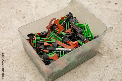 A set of tools for porcelain tile installation on in plastic box 