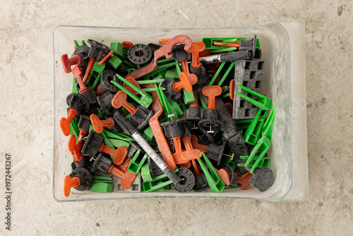 A set of tools for porcelain tile installation on in plastic box close up picture