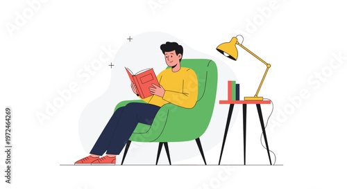 Relaxed man sitting in a comfortable green armchair and reading a book under a lamp in a quiet atmosphere.