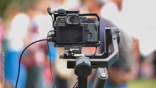 Canvas Print Professional video camera on gimbal rig filming live events at India Day festiva