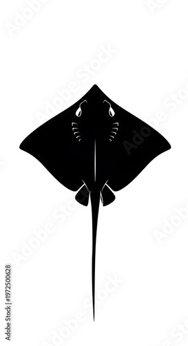 Black silhouette of a stingray swimming.