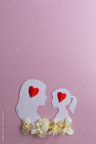 Mother and daughter love concept with paper hearts