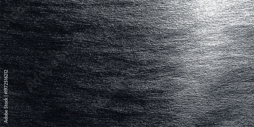 Dark blue denim textile background with a rough cotton fabric pattern and macro closeup texture of clothing material for fashion design