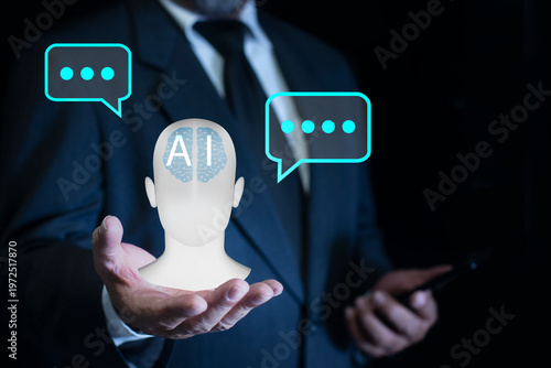 Man in suit holding AI Digital chatbot with speech bubbles symbol on hand. Innovative artificial intelligence agent, AI robot application, innovation and technology assistance concept.