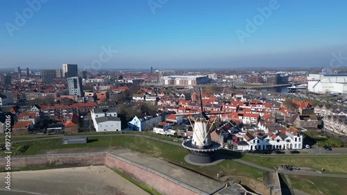 Vlissingen, Zeeland, the Netherlands. Aerial shot of coastline with windmill and city in the background.