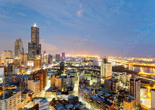 Wallpaper Mural Aerial view of Kaohsiung at dusk, a vibrant seaport city in South Taiwan, with the famous landmark 85 Sky Tower standing by the harbor in background and street lights dazzling in blue evening twilight Torontodigital.ca