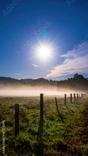 Serene Landscape with Mist and Bright Moon in Night Sky