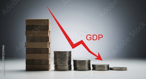GDP growth decline concept with stacked coins and downward red arrow on gray background