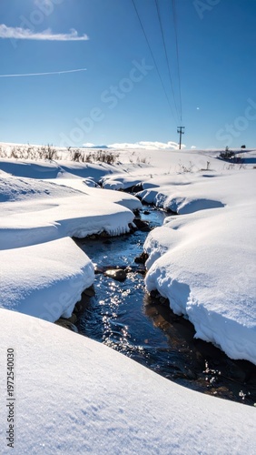 Snowy Landscape with Stream Flowing Through Winter Wonderland