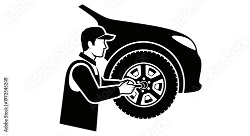 Mechanic changing a car tire.