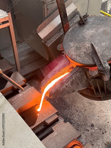 Obraz na płótnie Melted metal pouring in to the sand mold in die casting process