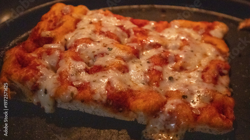 Pizza slices in the owen, 