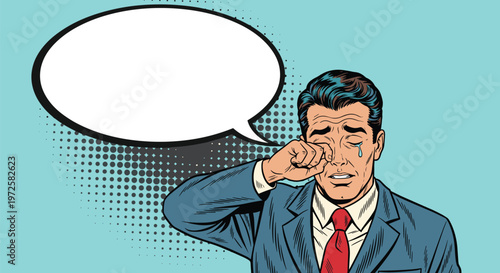 Distraught businessman in a blue suit wipes a tear from his eye next to a blank white speech bubble for text.