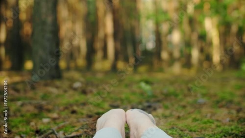 Woman meditates, relaxes and make yoga exercises in the woods alone
