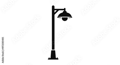 Black street lamp post with shade.