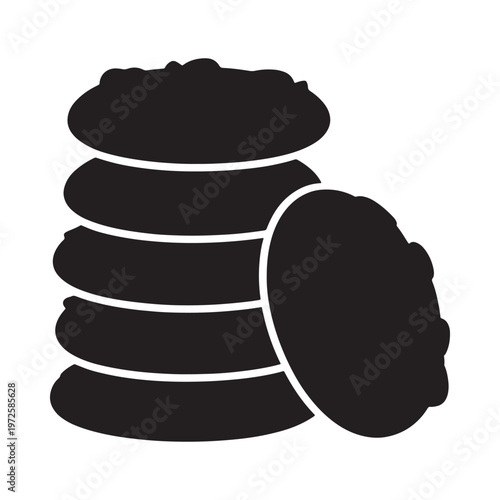 A stack of chocolate chip cookies with one leaning aside