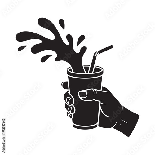 A hand holding a spilling cup with a straw black and white