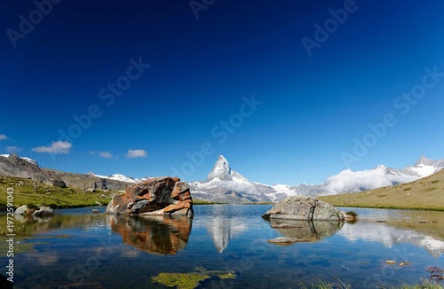 Fotografie Scenery of the iconic Matterhorn mountain on a beautiful summer morning, with it