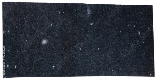 Dark gray paper with spotted print, scrap cut out from magazine isolated for collage