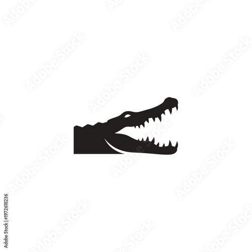 Black silhouette of a crocodile head.