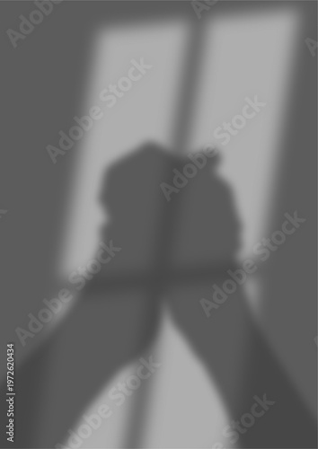Fényképezés Grey blurry image shows clasped hands in window light