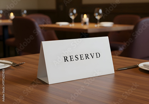 Restaurant table with reserved sign in a fine dining establishment.