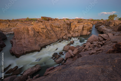 Orange river flowing in arid canyon near Augrabies Falls