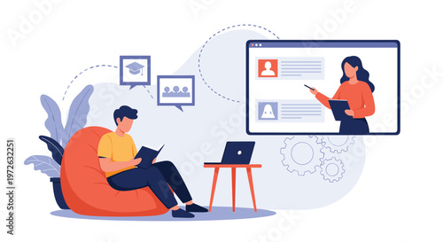 Student sitting in a bean bag chair and reading a book while following an online educational video lecture on his computer.