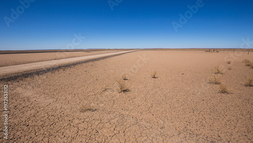 Valokuva Sand road area cutting through the arid and barren Northern Cape landscape en ro