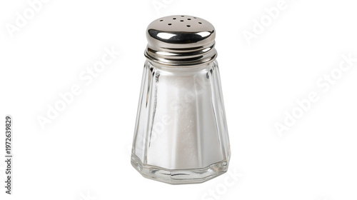A clear glass salt shaker with a silver lid on a black background