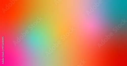 A vibrant, blurred gradient of colours blending from red to orange, yellow and blue