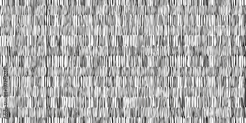 Abstract black and white texture resembling woven straw or stacked paper