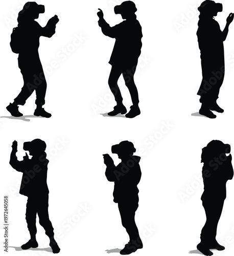 Multiple black silhouettes of different people wearing virtual reality headsets engaged in various interactive activities while experiencing an immersive digital environment in a white isolated space