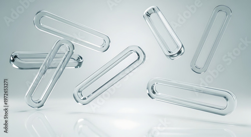 Abstract transparent glass capsules or pills floating in a clean minimalist studio setting representing health medicine or science concepts