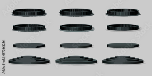 Arrangement of black cylindrical and stepped objects on a gray background