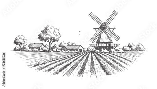 Rural landscape with windmill farm buildings and cultivated fields
