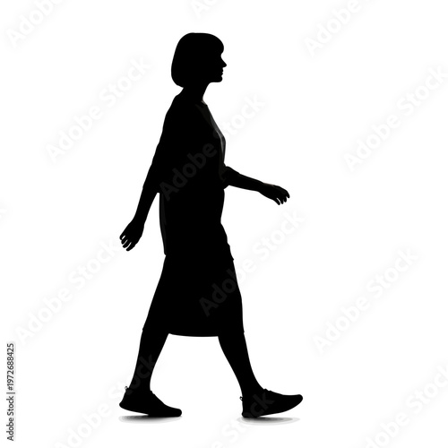 A silhouette of a woman walking in a confident stride