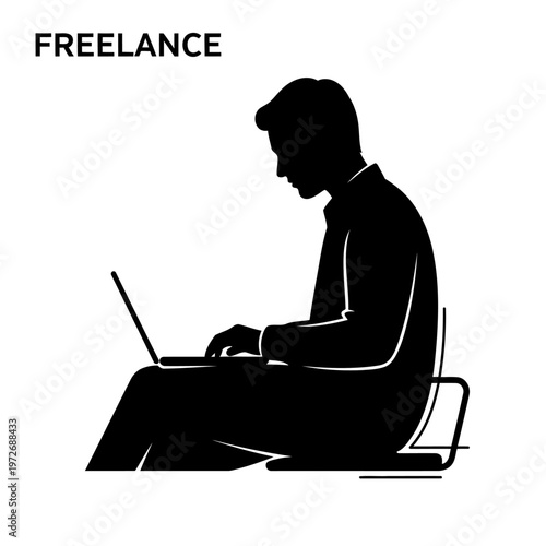 A silhouette of a man working as a freelancer on his laptop