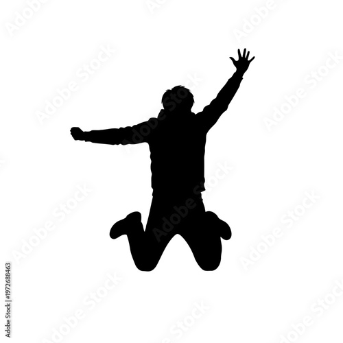 A silhouette of a man jumping in the air with joy and freedom