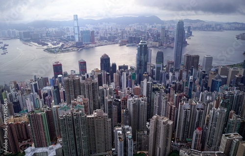 Photography Aerial view of Hong Kong on a gloomy day, from top of Victoria Peak, with a city