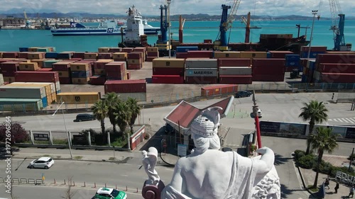 Aerial view of a 1930s architectural sculpture of a goddess on a ship prow, Port of Durres.