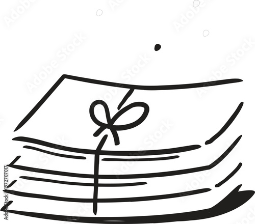 A stack of papers tied with a ribbon