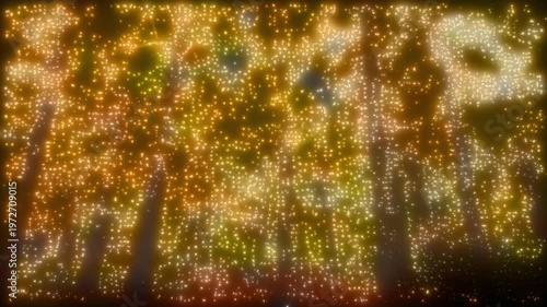 Abstract Glitter Trees Golden Stars 4K Loop features and abstract video that depicts a forest with particle lights flashing with occasional light streaks in a loop.