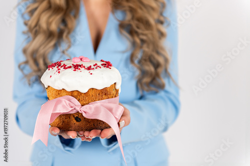 girl with Russian Easter kulich cake