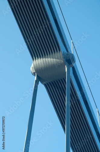 Pinned hanger connection on a steel bridge in blue sky close up