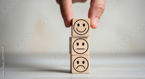 Customer Satisfaction Concept. Hand Adding Happy Face Wood Block. Client Review, Feedback, Service Evaluation, Ranking, Opinion, Survey, Support.