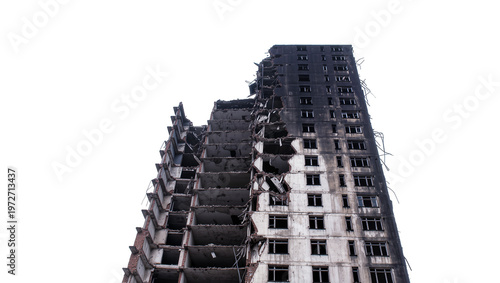 Isolated severely damaged, burned, and ruined multi-story building after war or catastrophe.