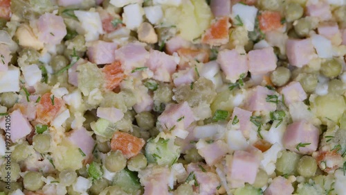 Salad with vegetables. Creamy vegetable and ham salad. Closeup of vibrant vegetable and ham salad. Studio shot highlighting colorful chopped vegetables and ham mixture