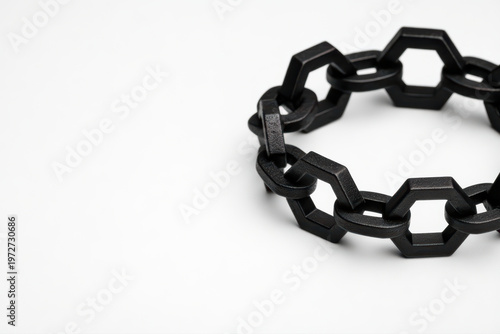 Black geometric chain bracelet on white background, modern jewelry design with hexagonal and oval links, minimal style accessory for fashion and elegance