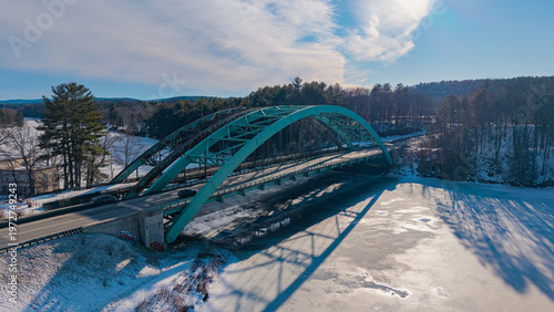 Fotografía Winter aerial view featuring the United States Navy Seabees Bridge over the froz